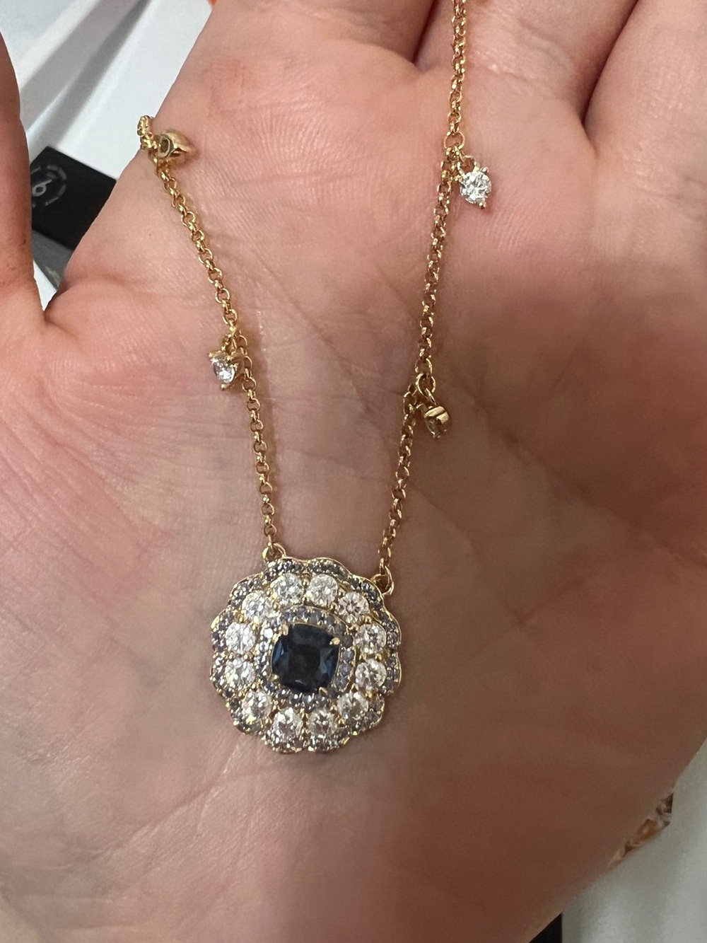 Delicate Gold Floral Pendant Necklace with Blue Center Stone